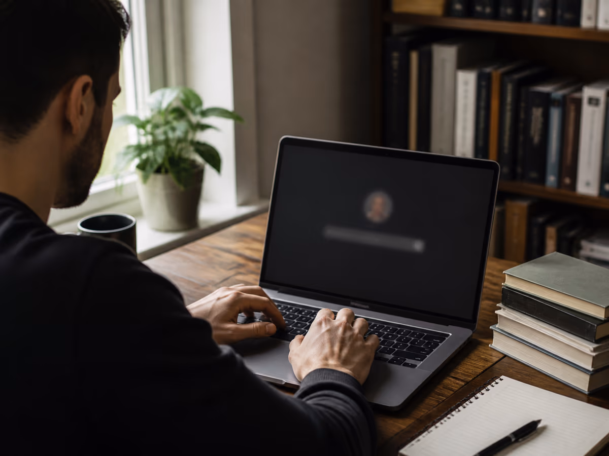 A user engaging with DuckDuckGo's onion service on a laptop in a home office.